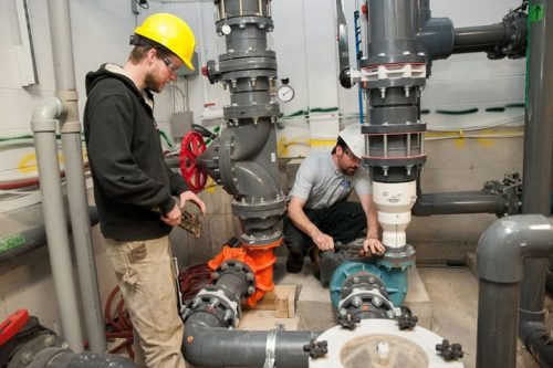 commercial-plumbers-working-on-pipes